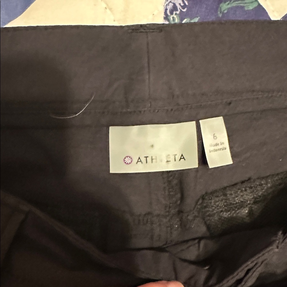 Athleta Charcoal flared Pants. Zippered pocket on lower leg. Side pockets - Picture 2 of 4